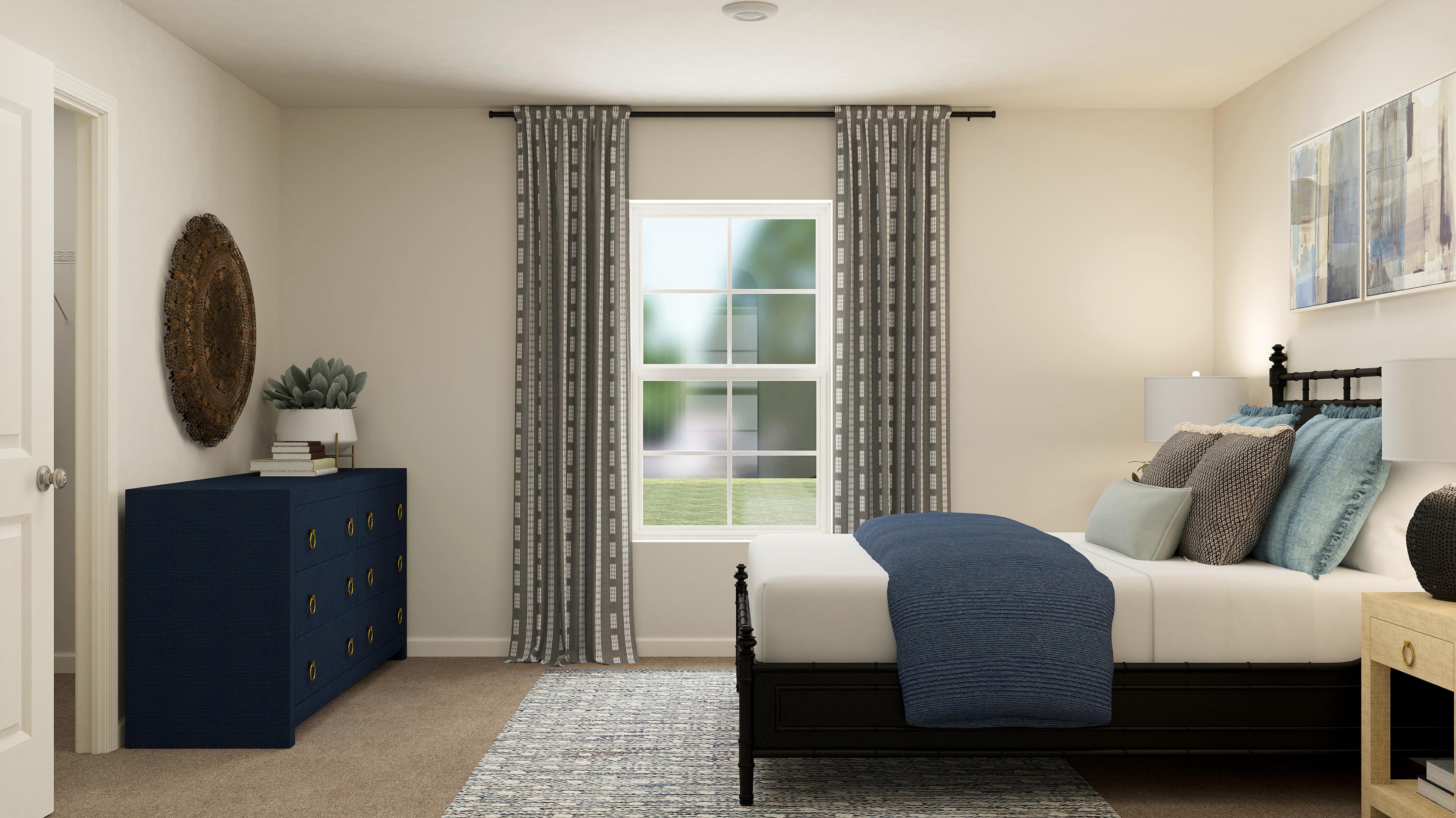 A bedroom with a bed and a window.