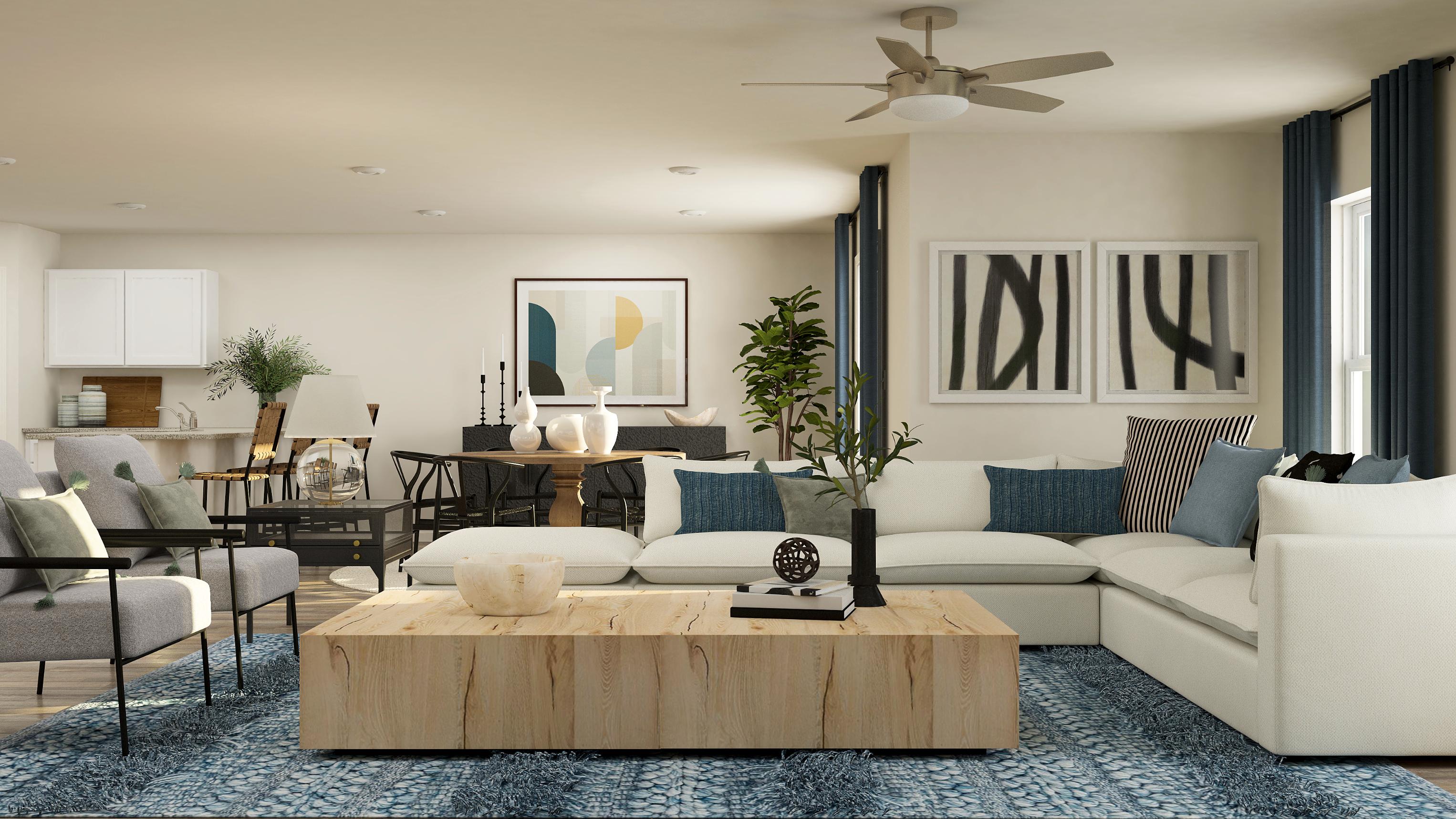 A living room with a large table and chairs.