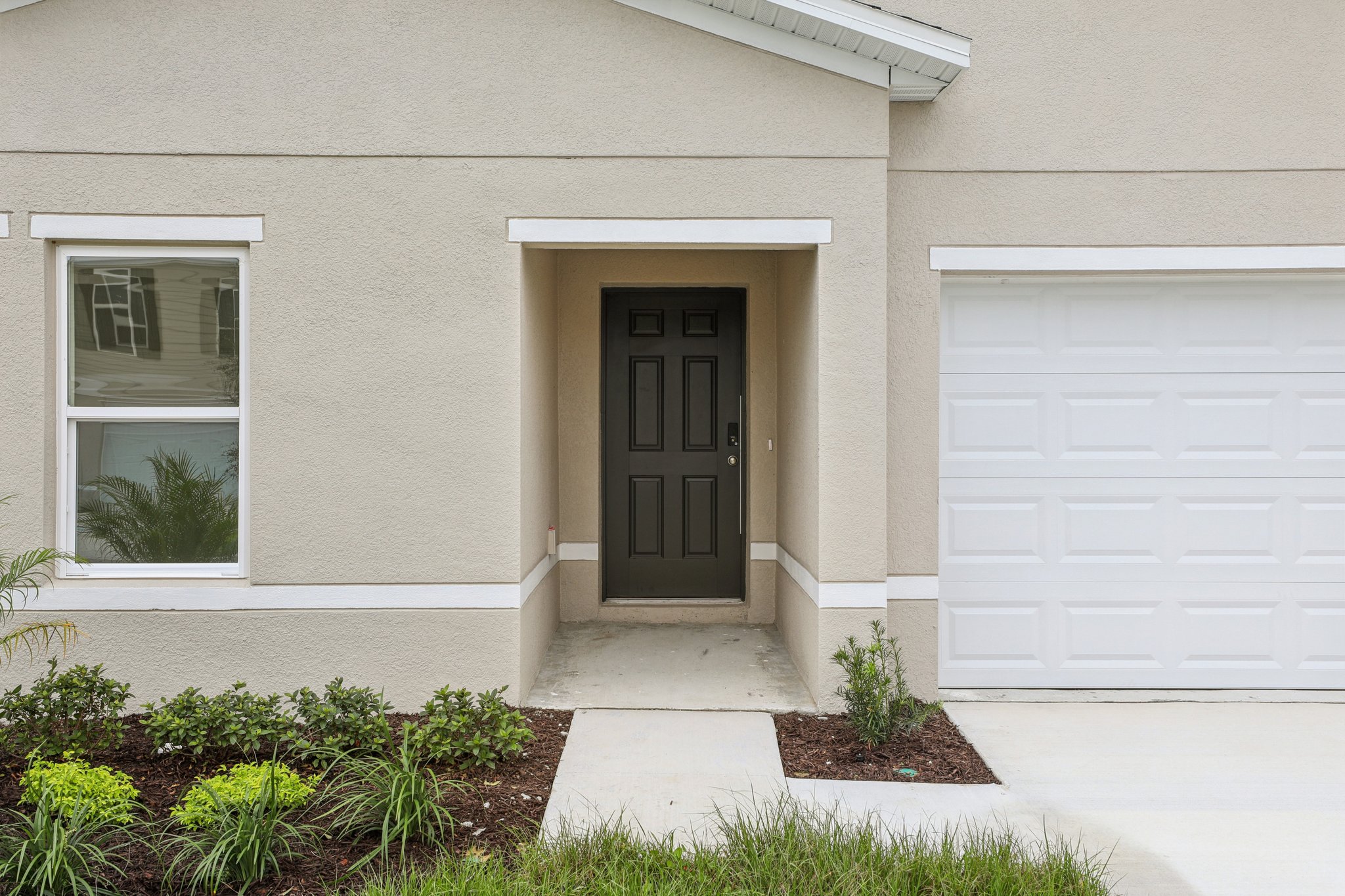 A white house with a black door.