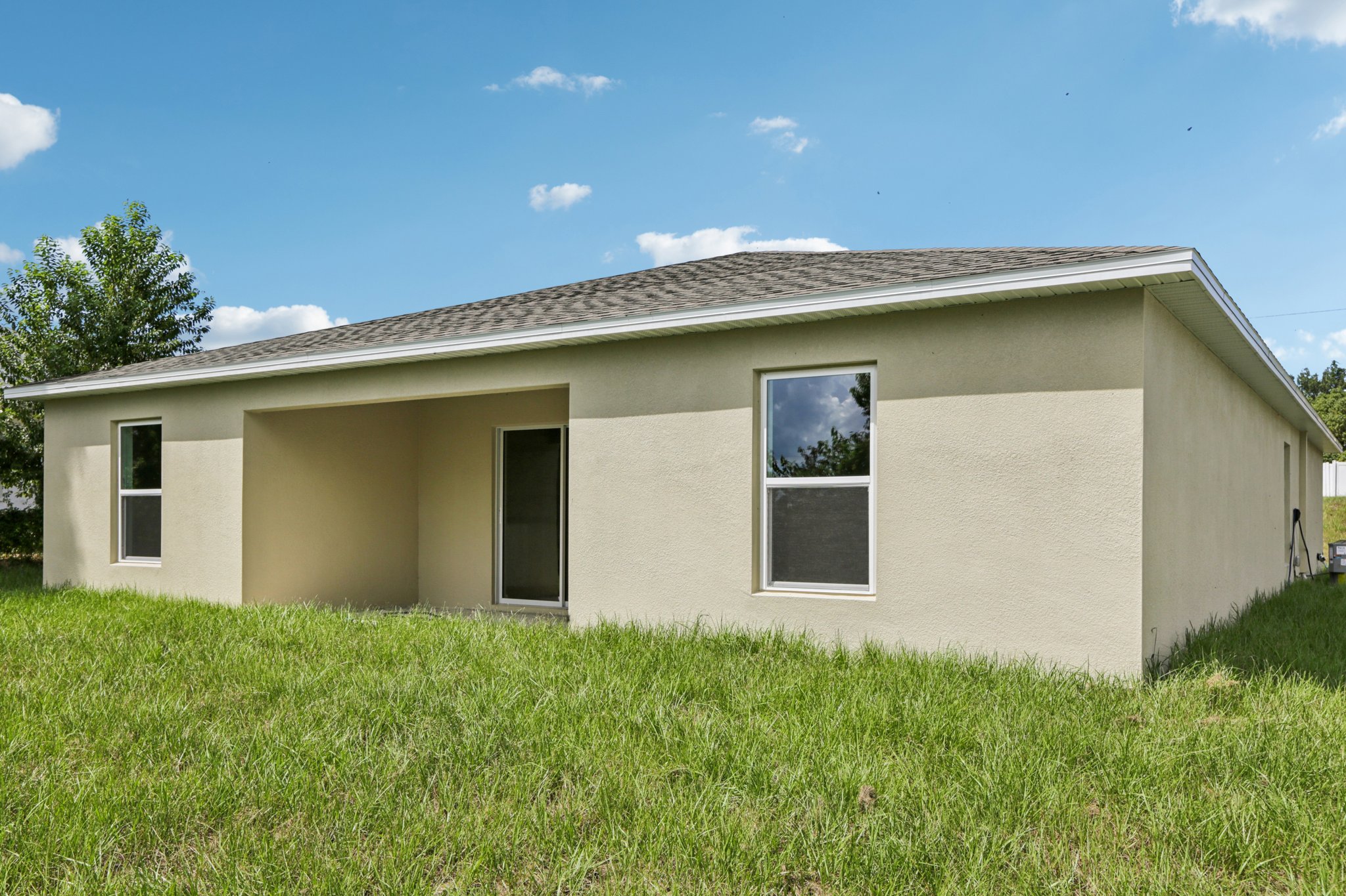 A house with a grass yard.