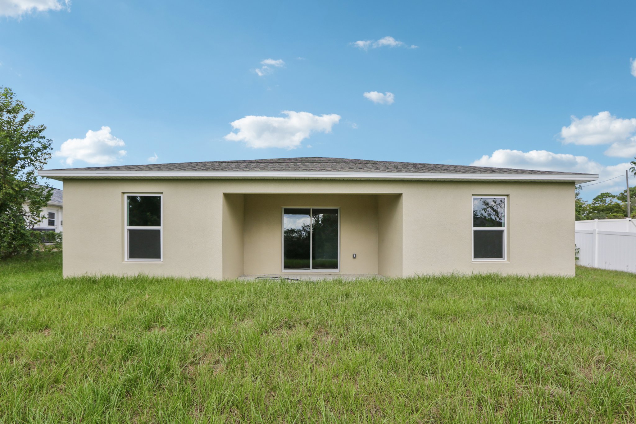 A house with a grass yard.