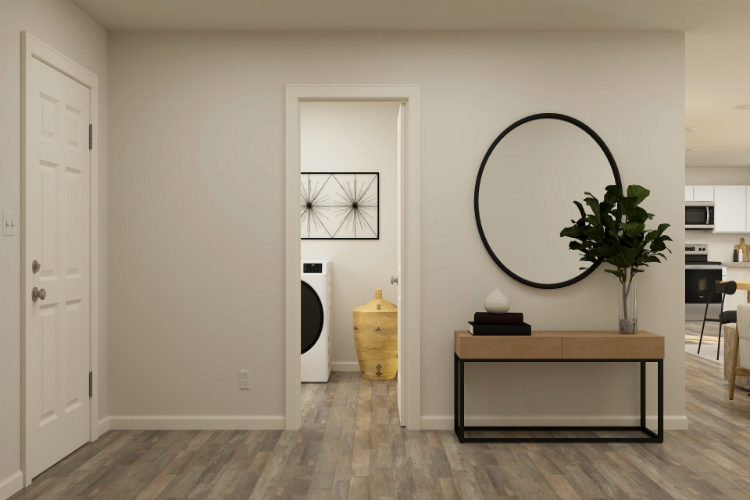 A room with a mirror and a table.