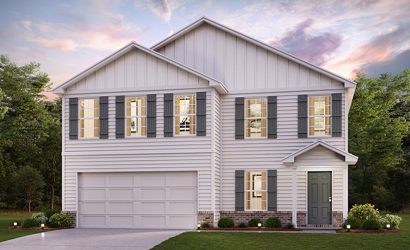 A white house with a garage.