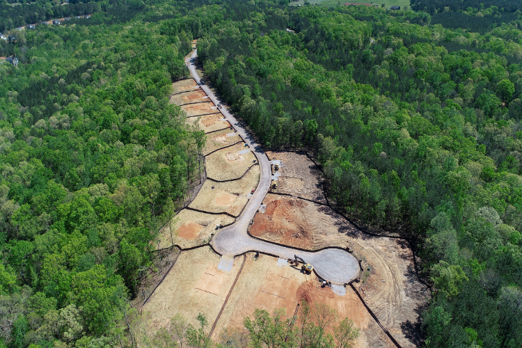 A large concrete structure surrounded by trees.