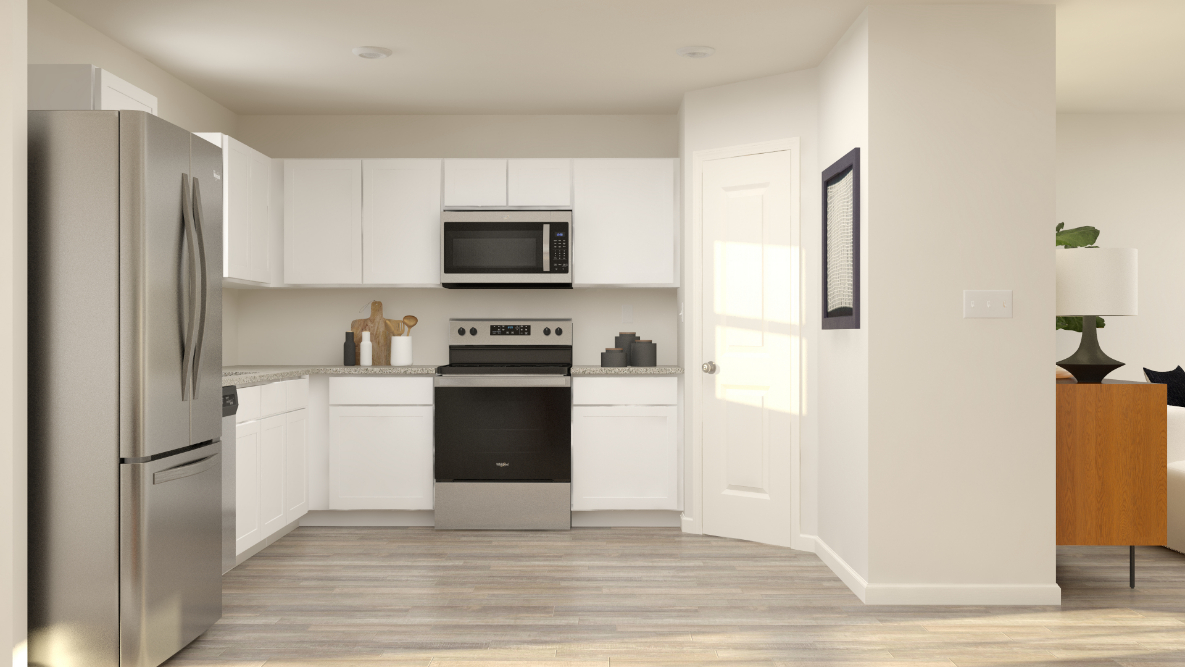 A kitchen with white cabinets.