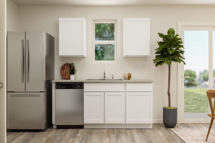 A kitchen with white cabinets.