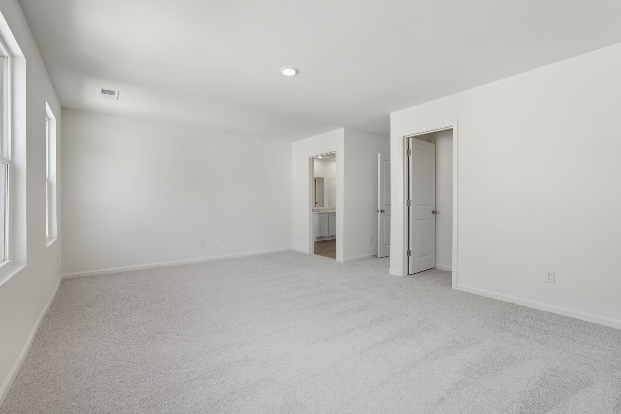 A long hallway with white walls.