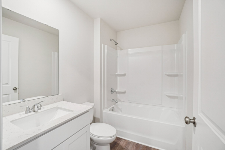 A bathroom with a toilet and sink.