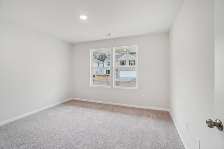 A room with a window and a door.