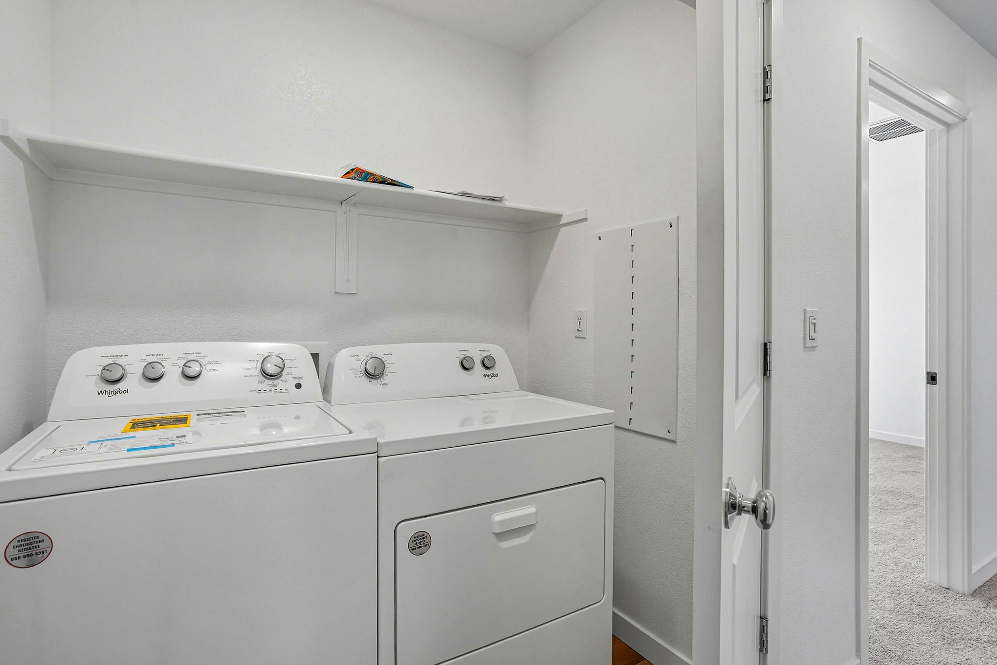 A washing machine in a room.